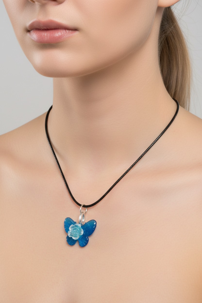A blue butterfly pendant necklace with a silver ring connector and black cord, displayed on a black velvet jewelry bust.